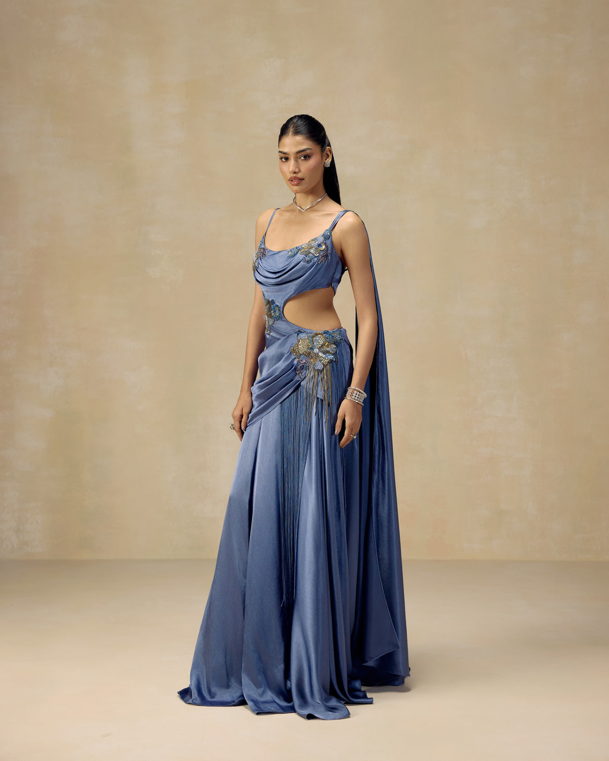 Blue textured satin anarkali gown with attached drape, waist cut-out and hand-knotted tassels — RINESSA