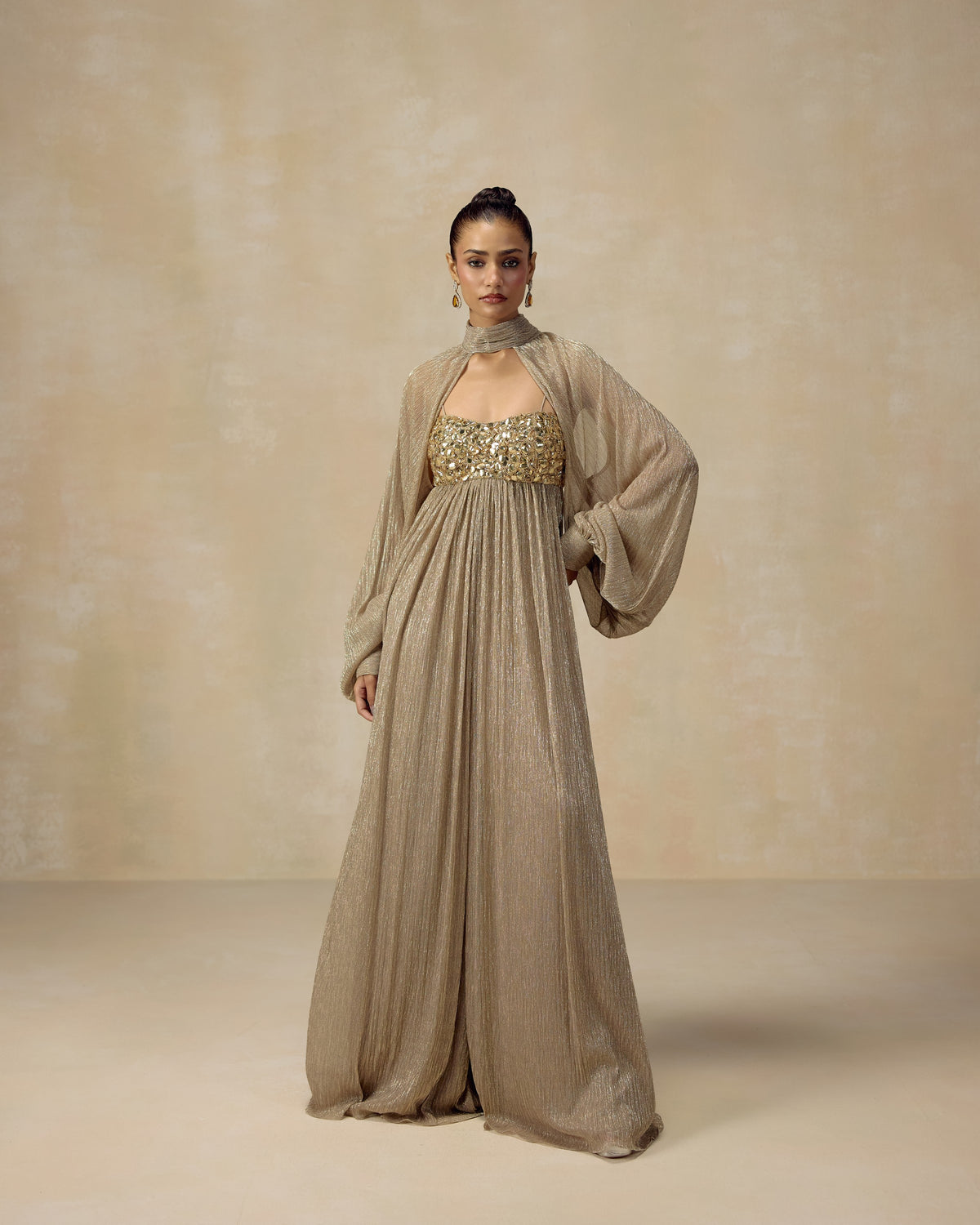 Gold shimmer jumpsuit with crystal bodice, straps and cape — RINESSA