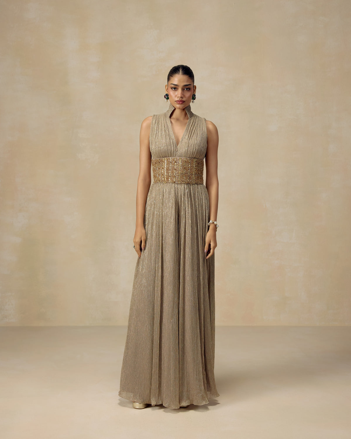 Gold shimmer high-neck jumpsuit with hand-worked crystal belt — RINESSA