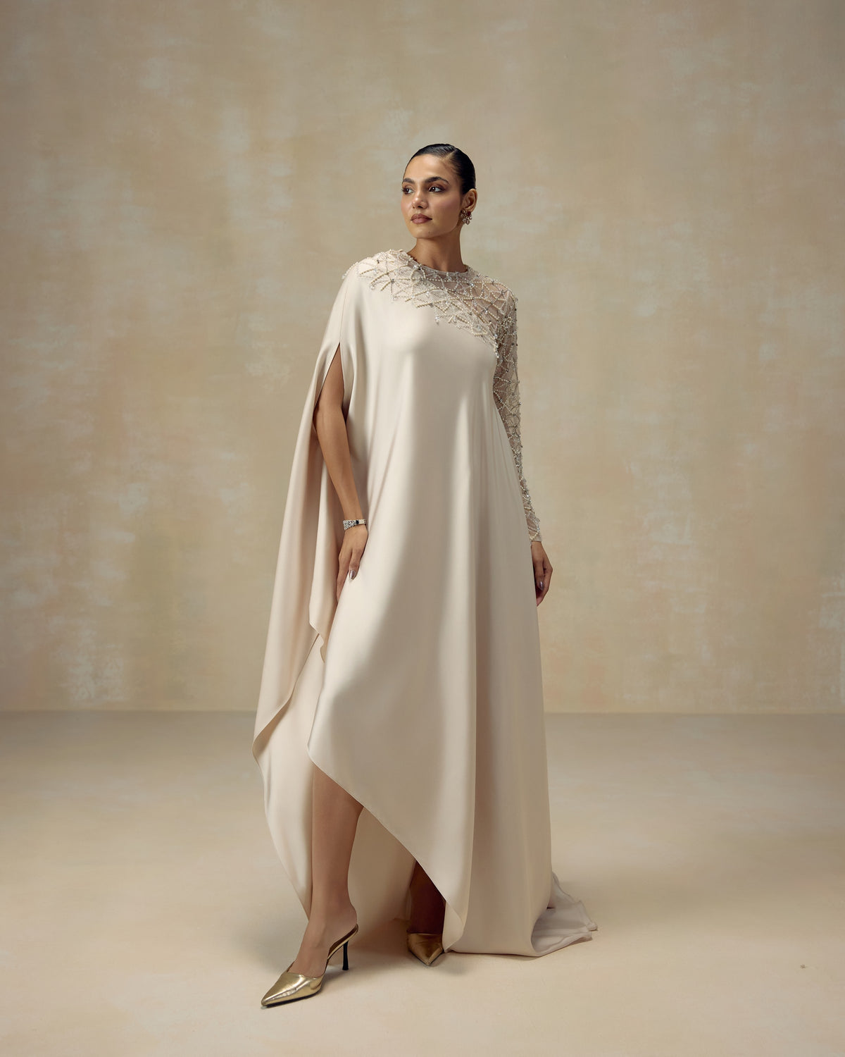 Ivory silk satin kaftan gown with pearls and crystals hand-set on a sheer sleeve — RINESSA