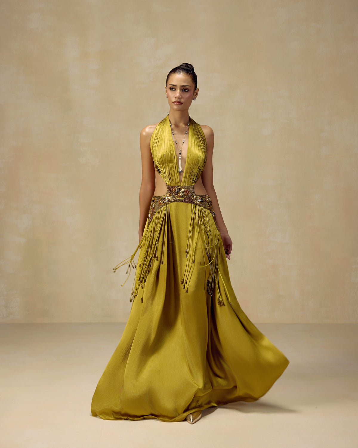 Olive satin backless halter gown with cut-out waist, dori embroidery and hand-knotted tassels — RINESSA