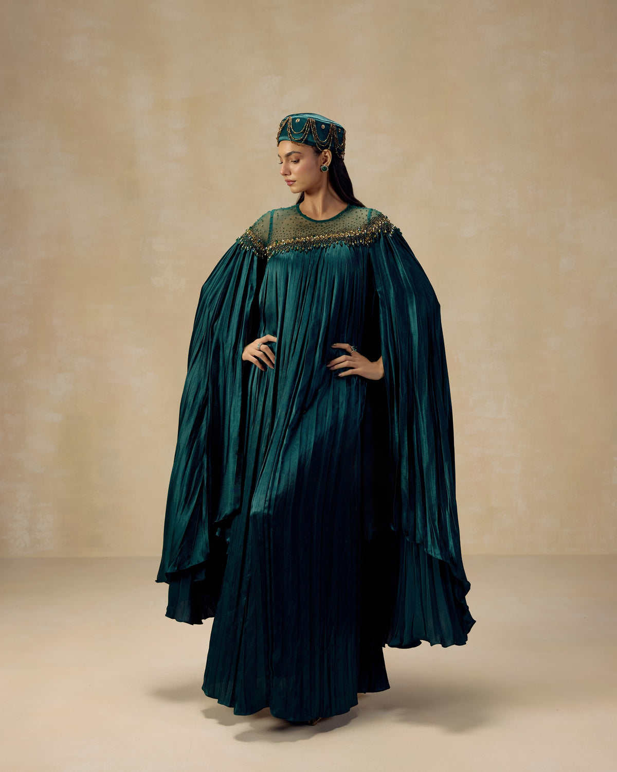Teal green pleated satin kaftan gown with sequin and hand embroidery at the neckline — RINESSA